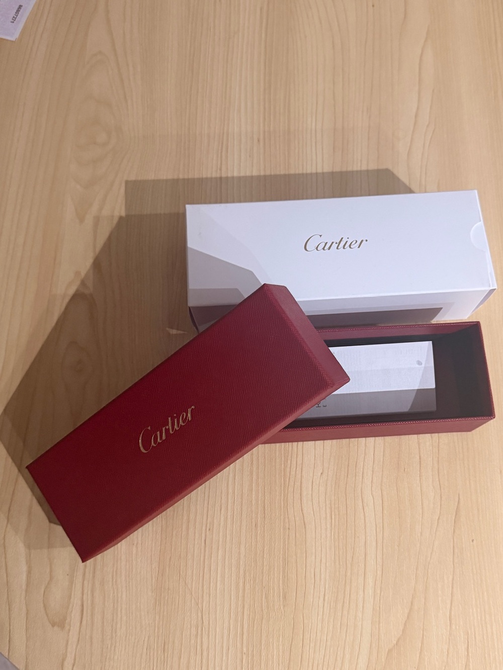 Cartier red sunglasses box with white sleeve and gold logo